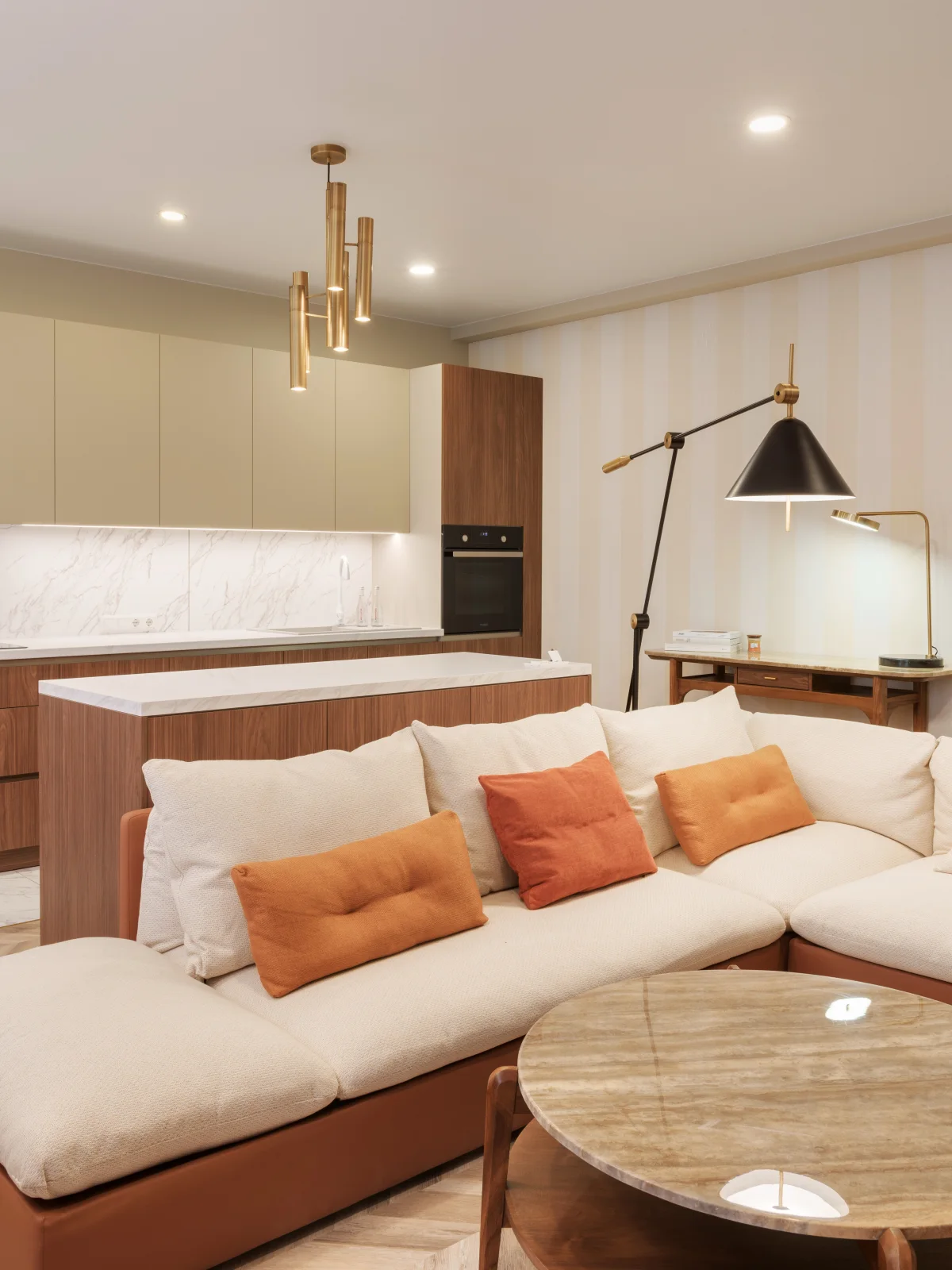 Living area with walnut and marble — completed apartment